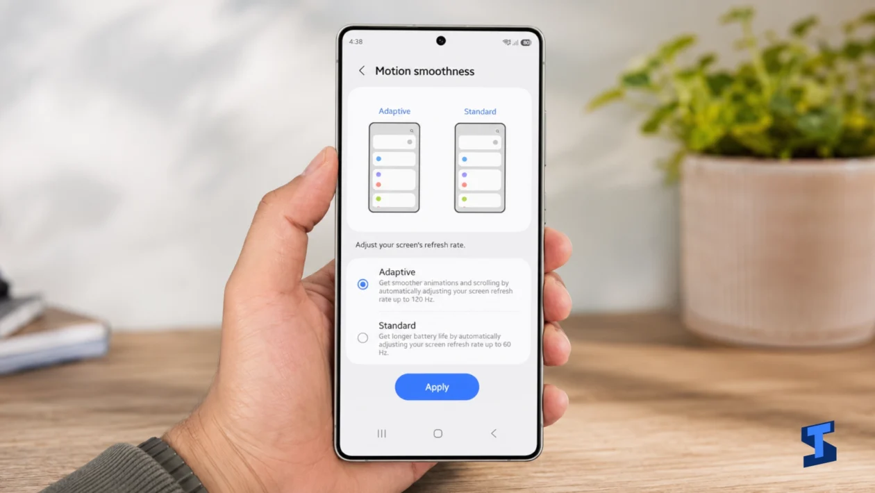 The owner holds a Galaxy S26 Ultra displaying the Motion smoothness settings, with Adaptive refresh rate up to 120Hz selected and Standard 60Hz mode shown below.